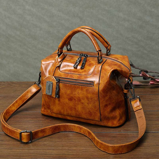 Luxurious leather women's handbag, high-quality PU shoulder & crossbody bags, chic brown hue with versatile styling at www.acheckbox.com